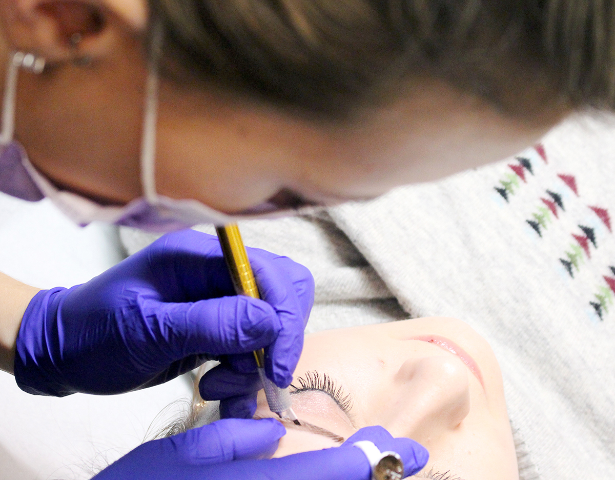 microblading service on a client