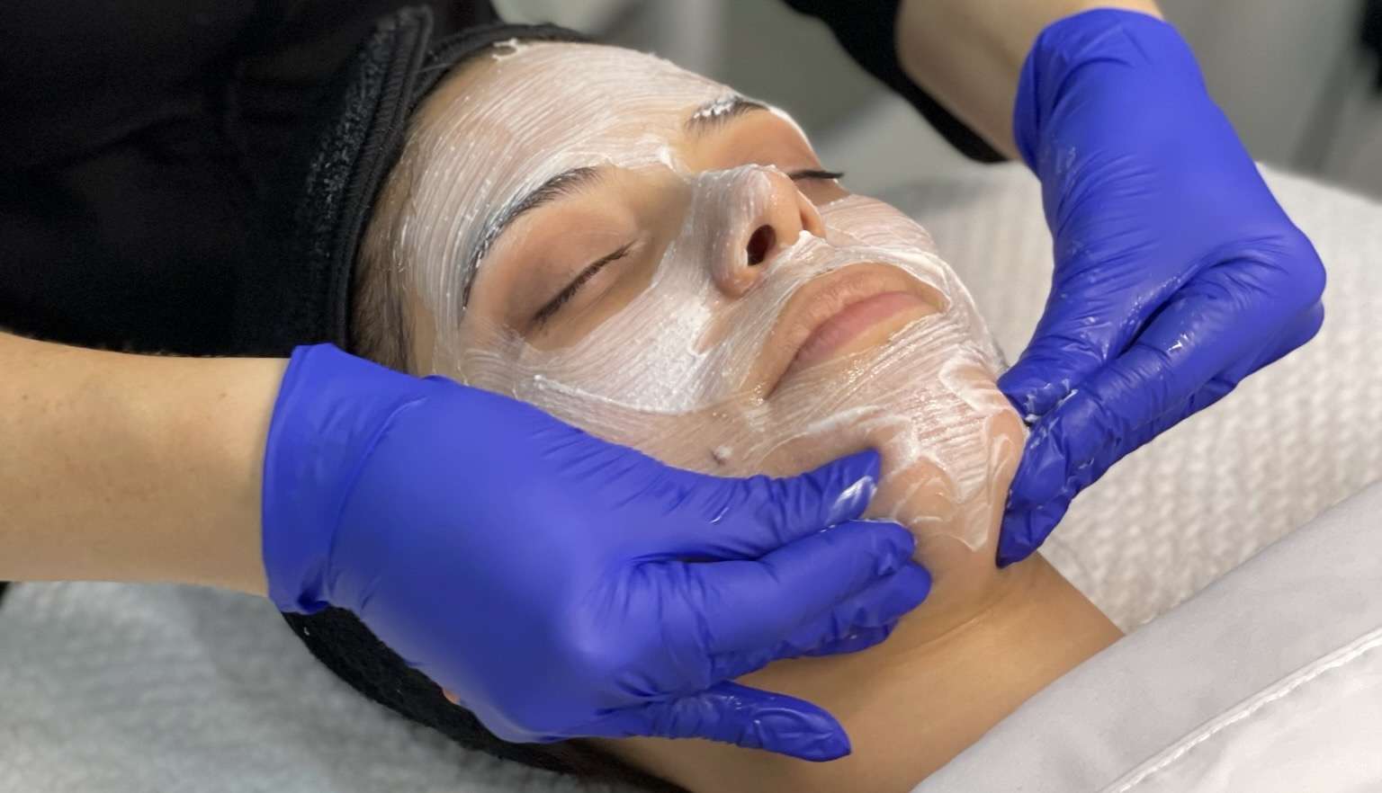 facial treatment on client