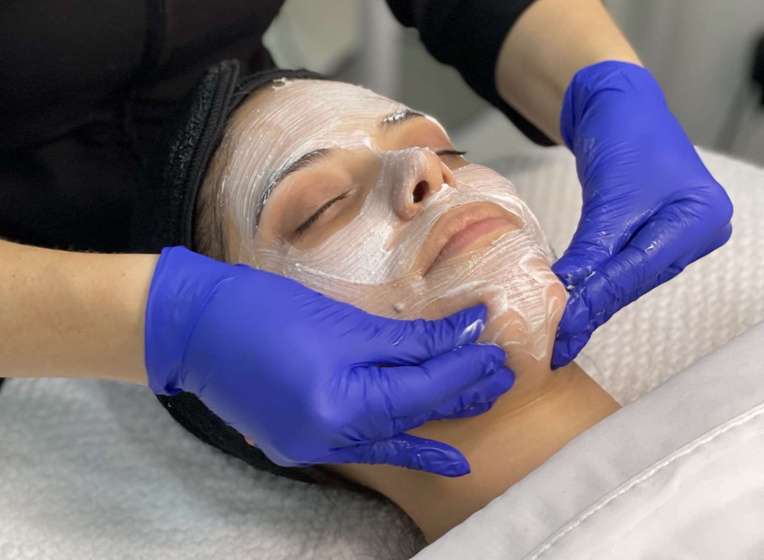 facial massage treatment on a client
