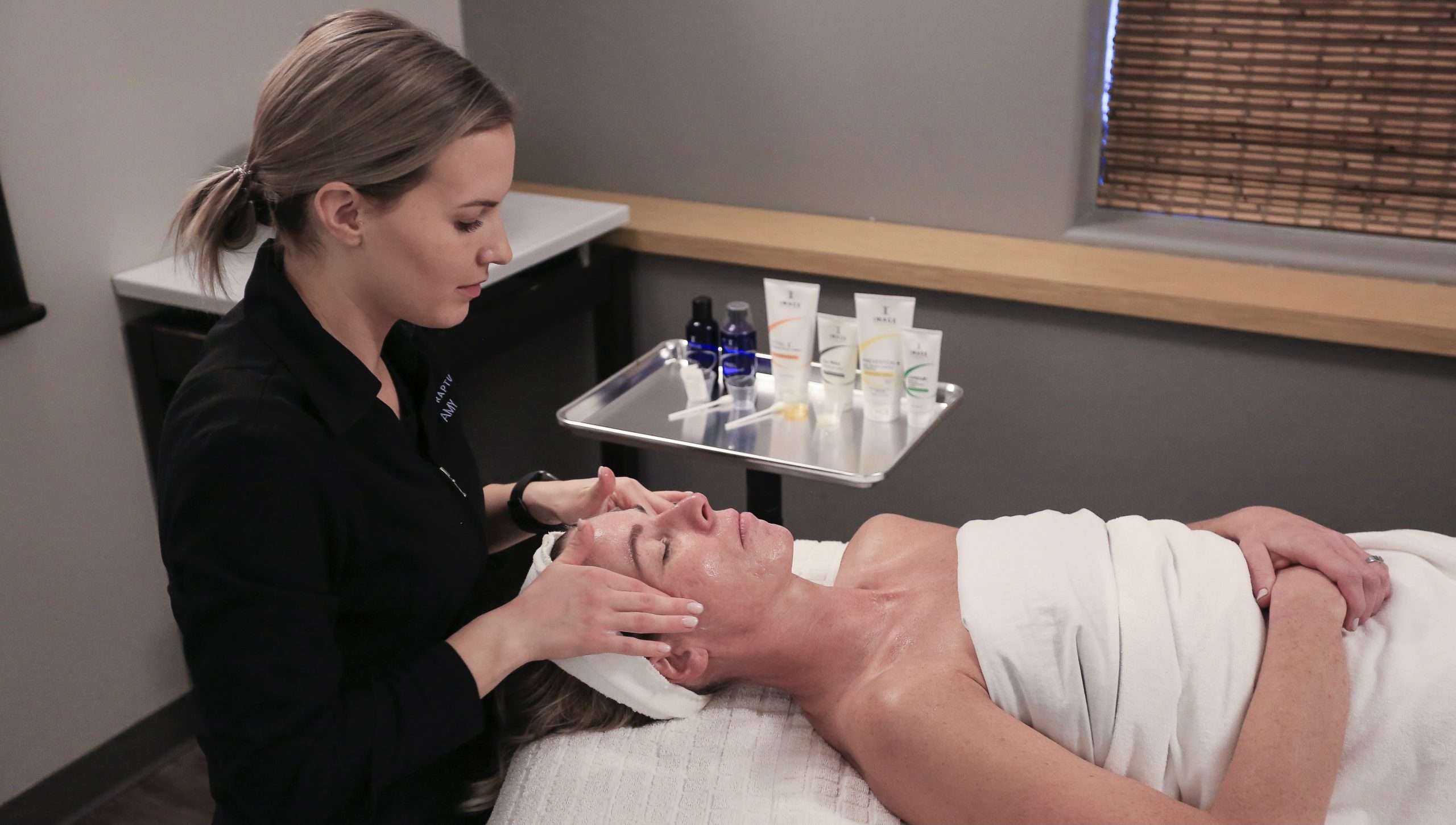 facial treatment on client