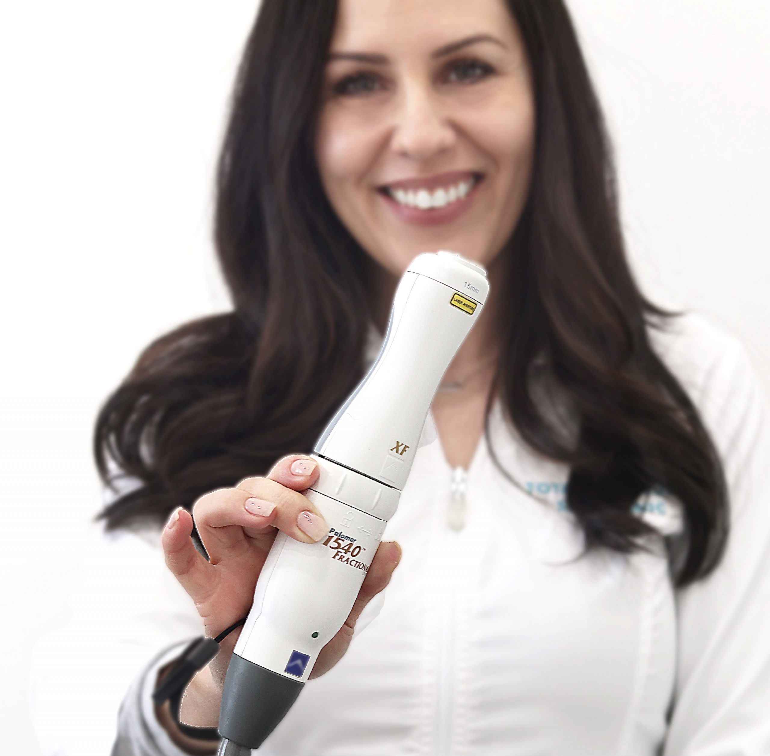 total wrapture esthetician holding fractional laser machine head