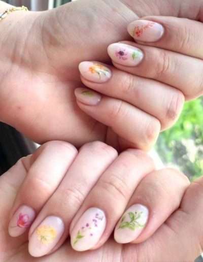 Neutral manicured nails with floral art