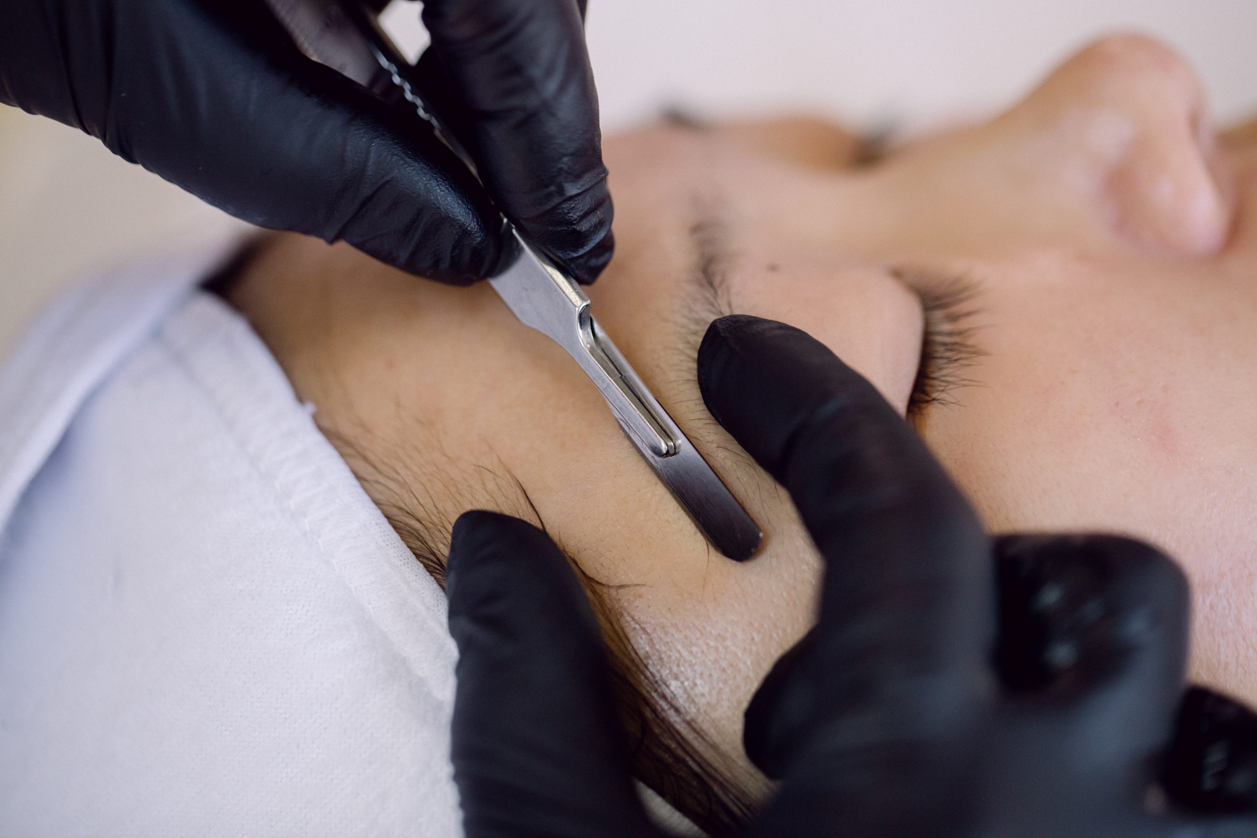 client getting a dermaplaning facial