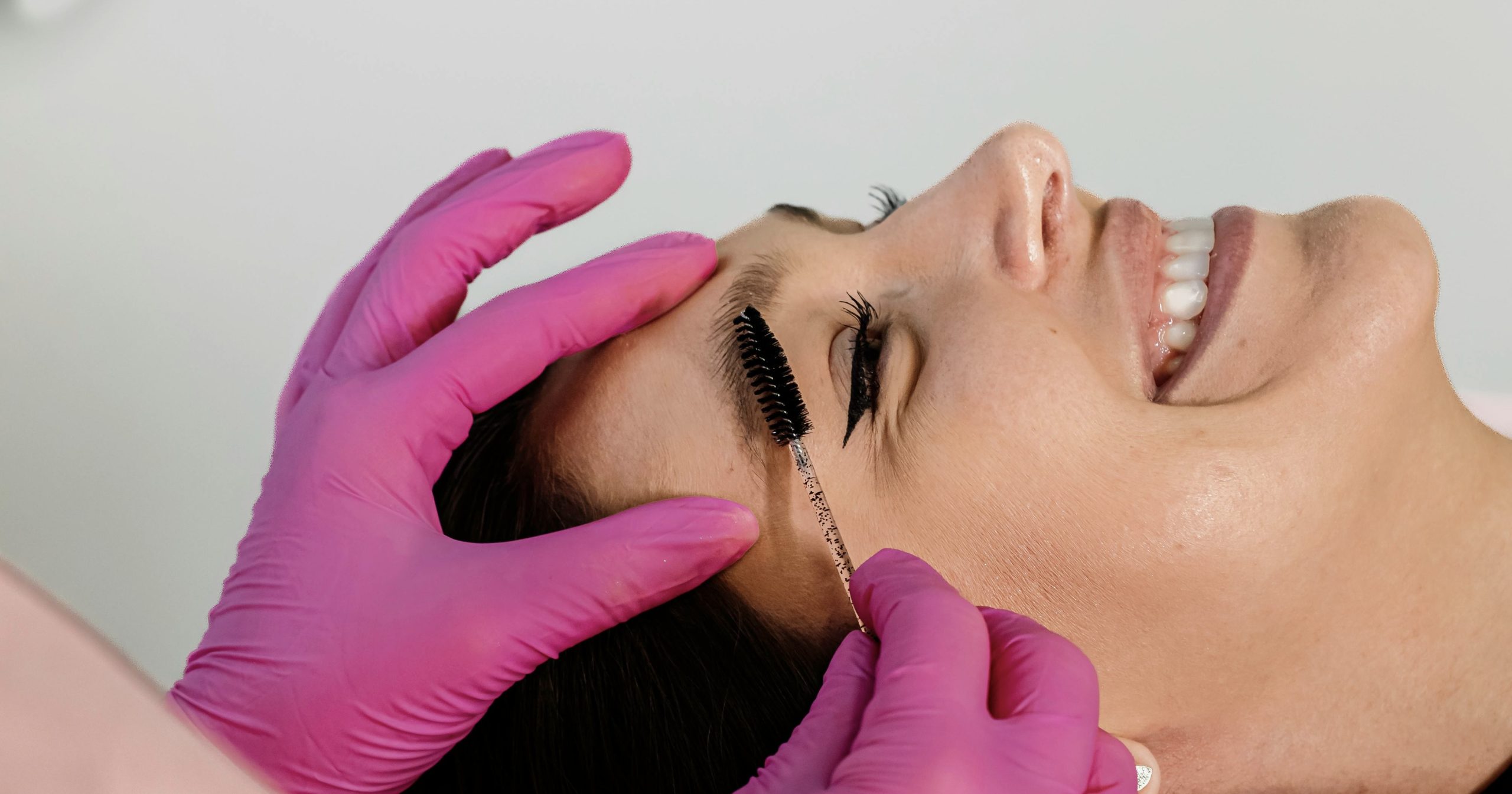 "client prepping for new microblading after laser brow pigment removal healed"