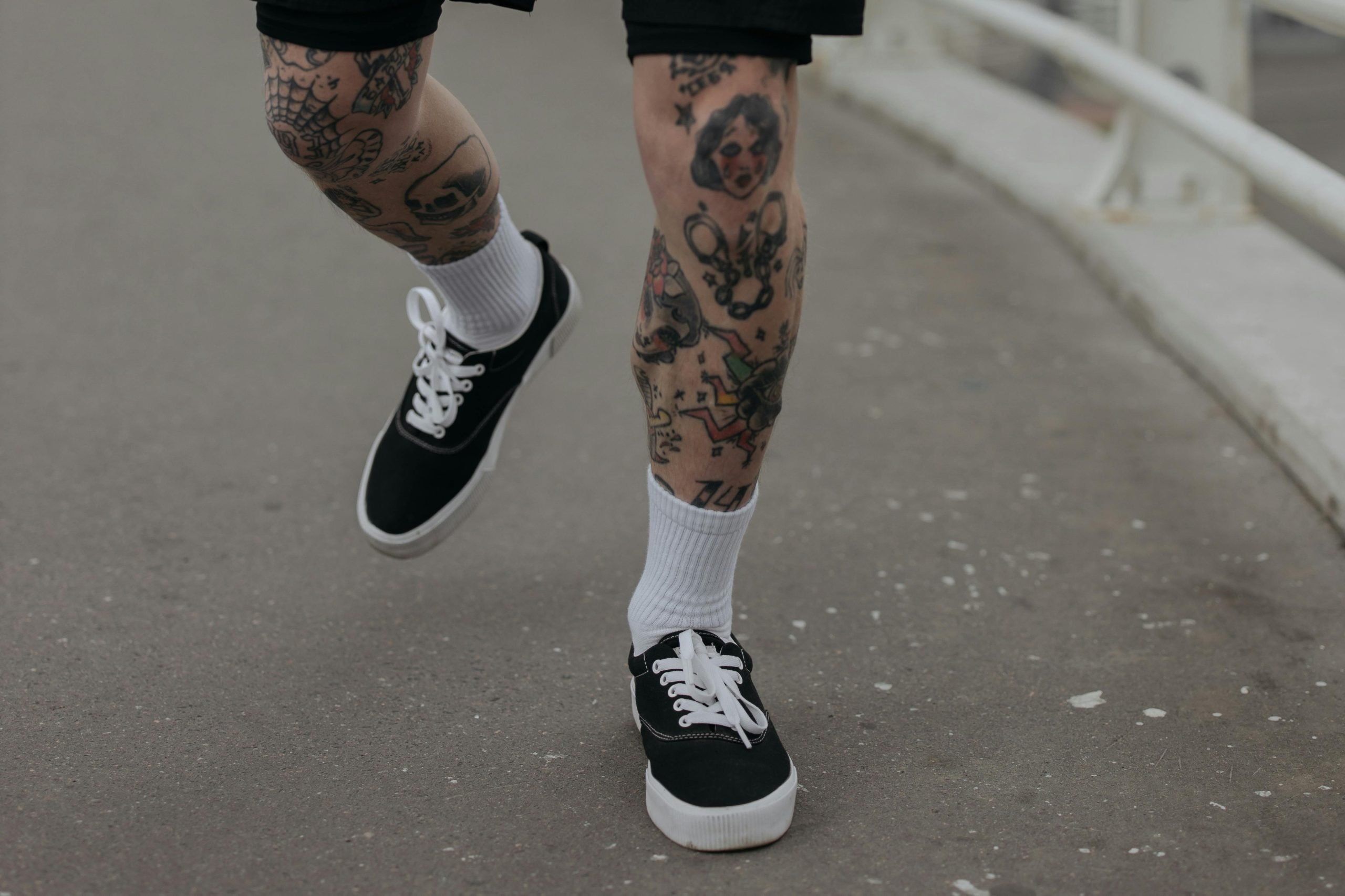 mens laser hair removal: tattooed and hair free legs